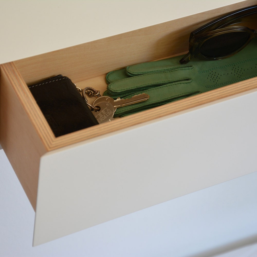White floating entryway shelf / narrow entryway table with hidden drawers