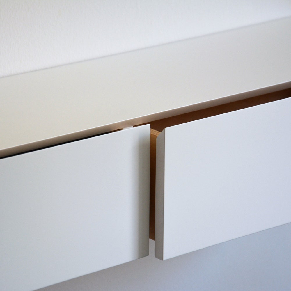 White floating entryway shelf / narrow entryway table with hidden drawers