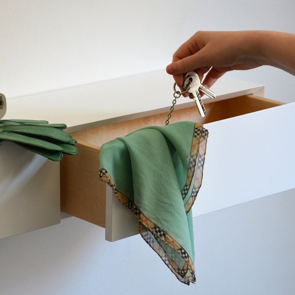 White floating entryway shelf / narrow entryway table with hidden drawers