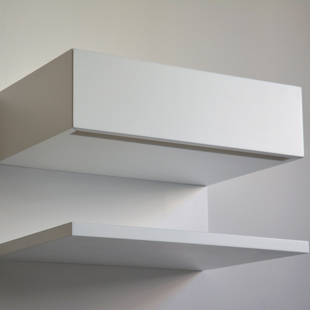 White floating nightstand with drawer and an extra shelf