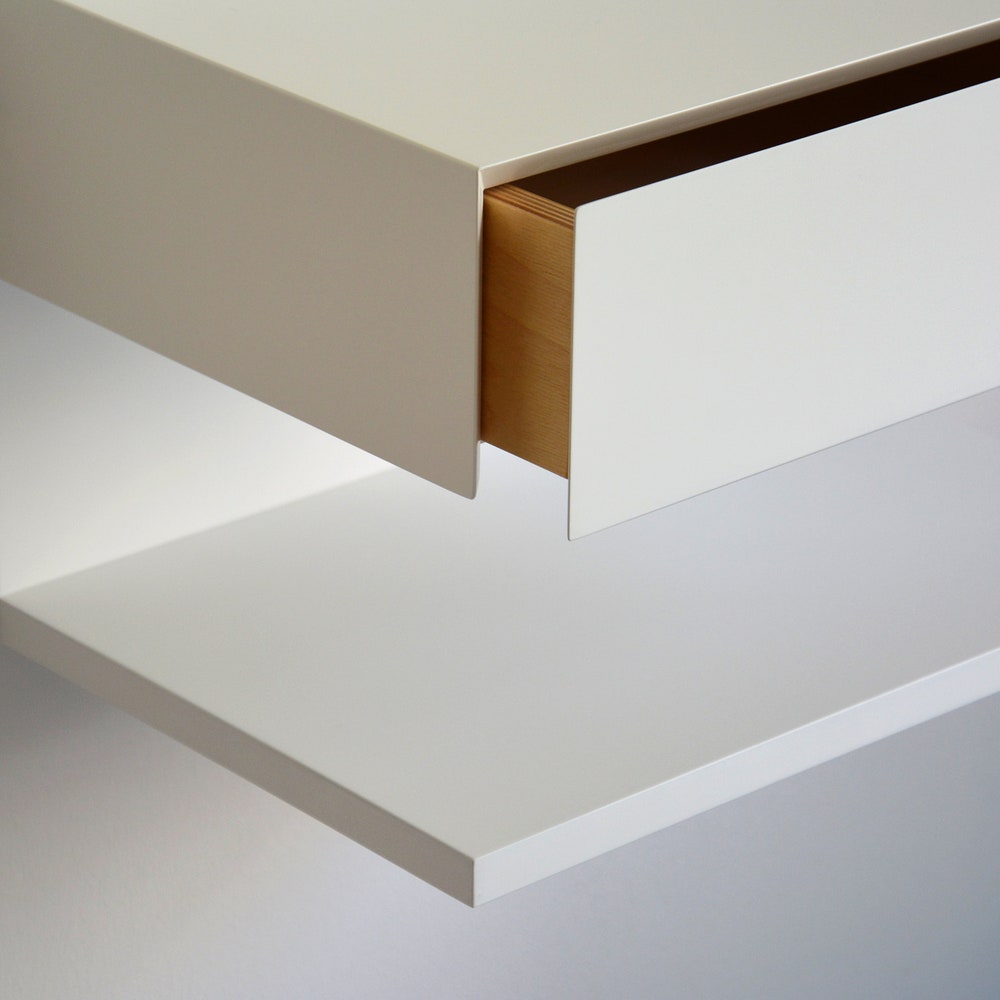 White floating nightstand with drawer and an extra shelf