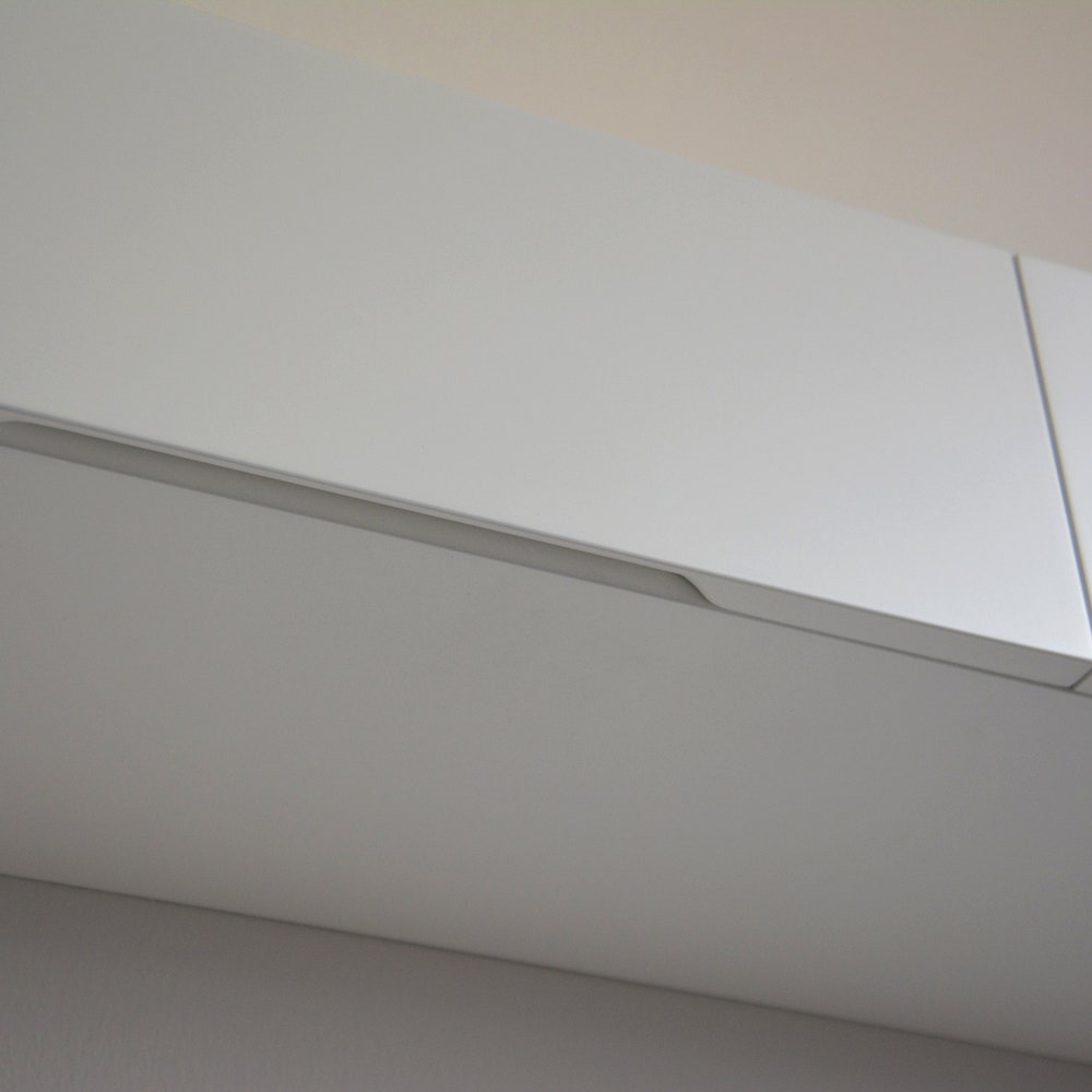 White floating entryway shelf / narrow entryway table with hidden drawers