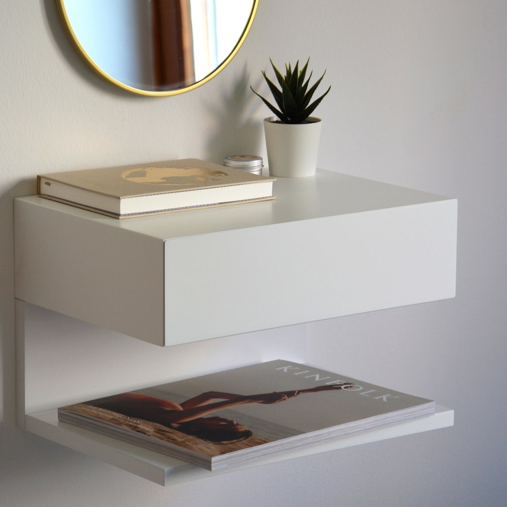 White floating nightstand with drawer and an extra shelf