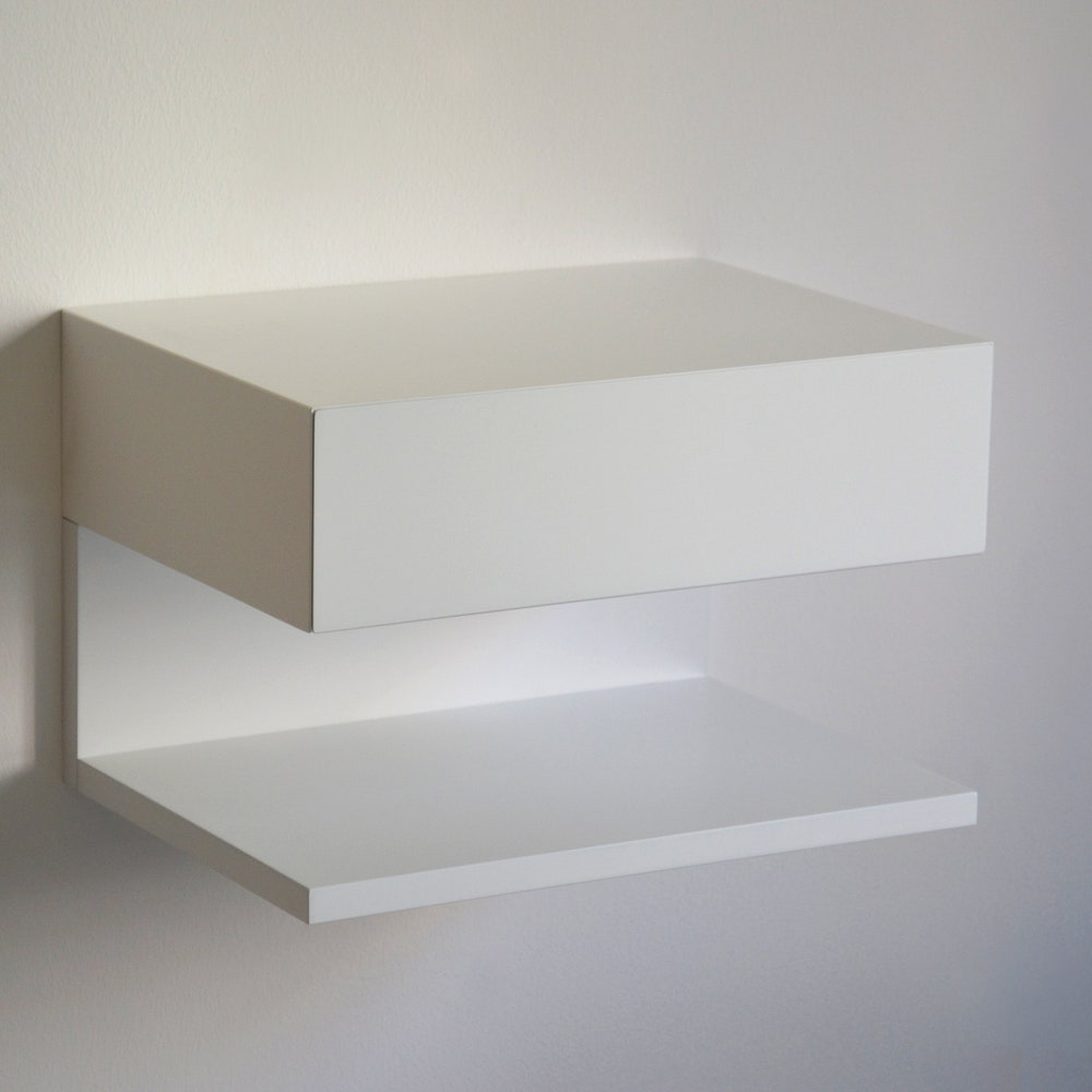 White floating nightstand with drawer and an extra shelf