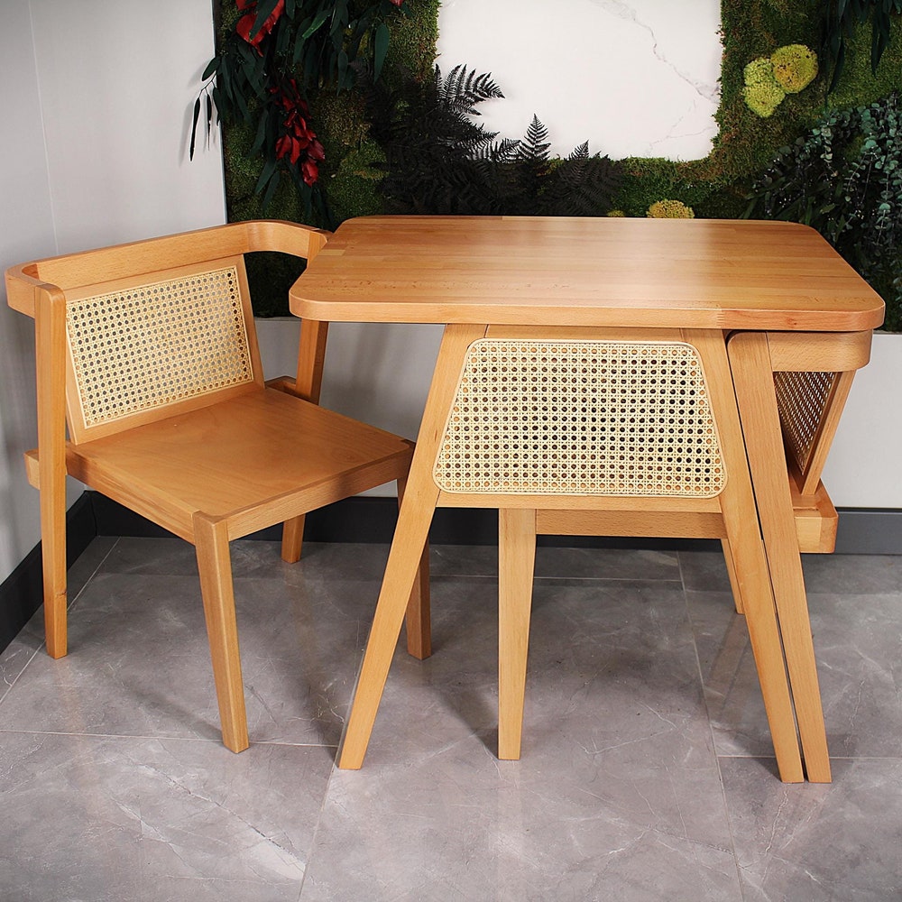 3-piece table and chair set. Perfect for limited spaces with its wicker and interlocking structure.