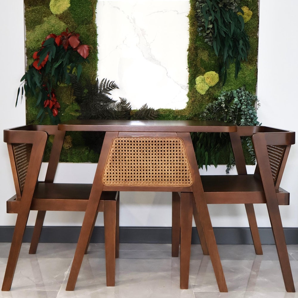 3-piece table and chair set. Perfect for limited spaces with its wicker and interlocking structure.